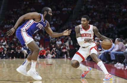Dec 5, 2022; Houston, Texas, USA; Houston Rockets guard Kevin Porter Jr. (3) controls the ball as Philadelphia 76ers guard James Harden (1) defends during the first quarter at Toyota Center. Mandatory Credit: Troy Taormina-USA TODAY Sports