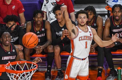 Jan 11, 2023; Clemson, South Carolina, USA; Clemson Tigers guard Chase Hunter (1) makes a three-point shot near the Louisville Cardinals bench during the first half at Littlejohn Coliseum. Mandatory Credit: Ken Ruinard-USA TODAY Sports