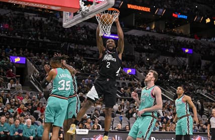 Jan 20, 2023; San Antonio, Texas, USA; LA Clippers forward Kawhi Leonard (2) dunks the ball past San Antonio Spurs guard Romeo Langford (35) and center Jakob Poeltl (25) during the first quarter at the AT&T Center. Mandatory Credit: Jerome Miron-USA TODAY Sports