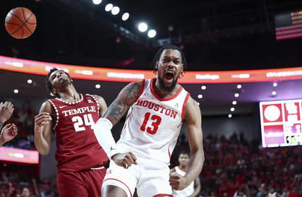 Jan 22, 2023; Houston, Texas, USA; Houston Cougars forward J'Wan Roberts (13) reacts after a play during the second half against the Temple Owls at Fertitta Center. Mandatory Credit: Troy Taormina-USA TODAY Sports