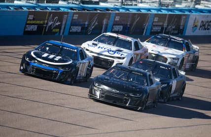 Jan 24, 2023; Avondale, AZ, USA; NASCAR Cup Series driver Erik Jones (43) races alongside Ross Chastain (1) during testing at Phoenix Raceway. Mandatory Credit: Mark J. Rebilas-USA TODAY Sports