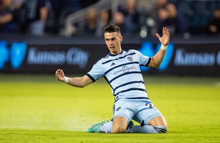 Apr 25, 2023; Kansas City, KS, USA; Sporting Kansas City midfielder Erik Thommy (26) slides after a foul during the second half against Tulsa Athletic at Children's Mercy Park. Mandatory Credit: Jay Biggerstaff-USA TODAY Sports