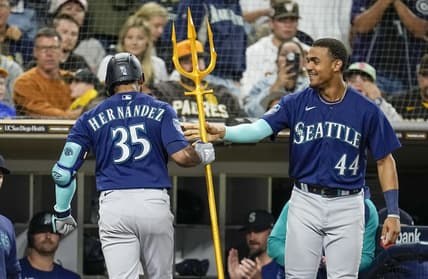 Jun 6, 2023; San Diego, California, USA;  Seattle Mariners right fielder Teoscar Hernandez (35) is congratulated by center fielder Julio Rodriguez (44) after hitting a solo home run against the San Diego Padres during the sixth inning at Petco Park. Mandatory Credit: Ray Acevedo-USA TODAY Sports