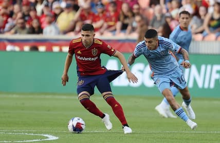 Jun 10, 2023; Sandy, Utah, USA; Real Salt Lake forward Jefferson Savarino (10) dribbles the ball against New York City FC midfielder Santiago Rodr guez (10 in the first half at America First Field. Mandatory Credit: Rob Gray-USA TODAY Sports