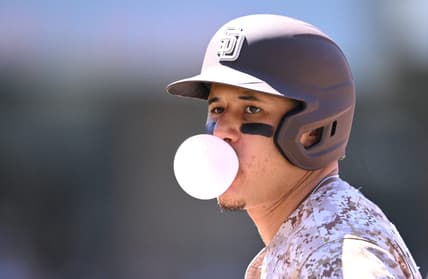 Jun 25, 2023; San Diego, California, USA; San Diego Padres third baseman Manny Machado (13) blows a bubble-gum bubble during the sixth inning against the Washington Nationals at Petco Park. Mandatory Credit: Orlando Ramirez-USA TODAY Sports