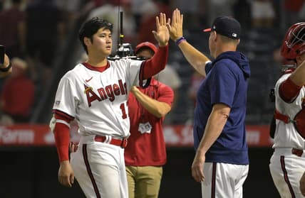 Jul 21, 2023; Anaheim, California, USA; Los Angeles Angels starting pitcher Shohei Ohtani (17) high fives as he leaves the field following the ninth inning against the Pittsburgh Pirates at Angel Stadium. Mandatory Credit: Jayne Kamin-Oncea-USA TODAY Sports