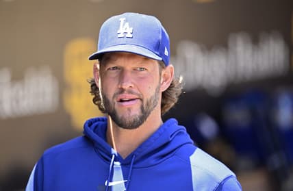 Aug 7, 2023; San Diego, California, USA; Los Angeles Dodgers pitcher Clayton Kershaw (22) looks on from the dugout before the game against the San Diego Padres at Petco Park. Mandatory Credit: Orlando Ramirez-USA TODAY Sports