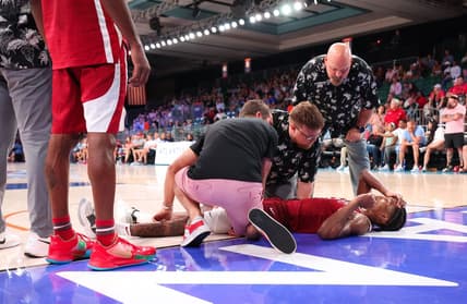 Nov 24, 2023; Paradise Island, BAHAMAS;  Arkansas Razorbacks guard Tramon Mark (12) lays injured on the ground during the second half against the North Carolina Tar Heels at Imperial Arena. Mandatory Credit: Kevin Jairaj-USA TODAY Sports