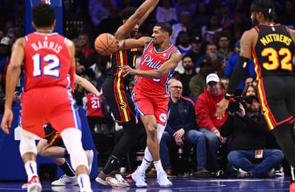 Dec 8, 2023; Philadelphia, Pennsylvania, USA; Philadelphia 76ers guard De'Anthony Melton (8) passes the ball against Atlanta Hawks forward De'Andre Hunter (12) in the first quarter at Wells Fargo Center. Mandatory Credit: Kyle Ross-USA TODAY Sports