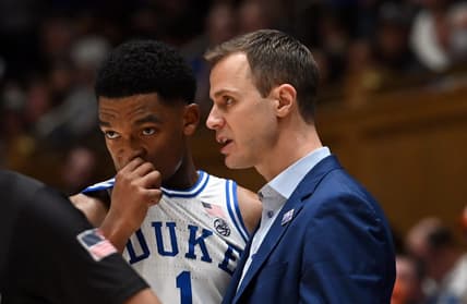 Jan 27, 2024; Durham, North Carolina, USA;Duke Blue Devils head coach Jon Scheyer (right) talks to guard Caleb Foster (1)  during the second half against the Clemson Tigers at Cameron Indoor Stadium. Mandatory Credit: Rob Kinnan-USA TODAY Sports