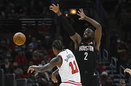 Dec 20, 2021; Chicago, Illinois, USA;   Chicago Bulls forward DeMar DeRozan (11) passes the ball against Houston Rockets forward David Nwaba (2) during the second half at the United Center. Mandatory Credit: Matt Marton-USA TODAY Sports