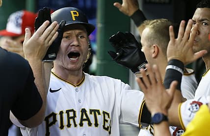 Jul 5, 2022; Pittsburgh, Pennsylvania, USA;  Pittsburgh Pirates right fielder Jack Suwinski (65) high-fives in the Pirates dugout after hitting a two run home run against the New York Yankees during the fourth inning at PNC Park. Mandatory Credit: Charles LeClaire-USA TODAY Sports