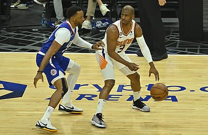 Apr 20, 2023; Los Angeles, California, USA; Los Angeles Clippers guard Norman Powell (24) guards Phoenix Suns guard Chris Paul (3) in the first quarter at Crypto.com Arena. Mandatory Credit: Jayne Kamin-Oncea-USA TODAY Sports