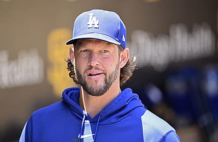Aug 7, 2023; San Diego, California, USA; Los Angeles Dodgers pitcher Clayton Kershaw (22) looks on from the dugout before the game against the San Diego Padres at Petco Park. Mandatory Credit: Orlando Ramirez-USA TODAY Sports