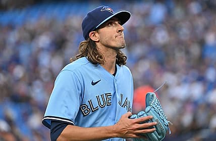 Aug 28, 2023; Toronto, Ontario, CAN;  Toronto Blue Jays starting pitcher Kevin Gausman (34) reacts after giving up a run to the Washington National in the first inning at Rogers Centre. Mandatory Credit: Dan Hamilton-USA TODAY Sports