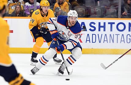 Dec 19, 2022; Nashville, Tennessee, USA; Edmonton Oilers center Connor McDavid (97) skates with the puck during the second period against the Nashville Predators at Bridgestone Arena. Mandatory Credit: Christopher Hanewinckel-USA TODAY Sports