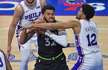 Apr 3, 2021; Philadelphia, Pennsylvania, USA; Minnesota Timberwolves center Karl-Anthony Towns (32) battles with Philadelphia 76ers forward Tobias Harris (12) during the second quarter at Wells Fargo Center. Mandatory Credit: Eric Hartline-USA TODAY Sports