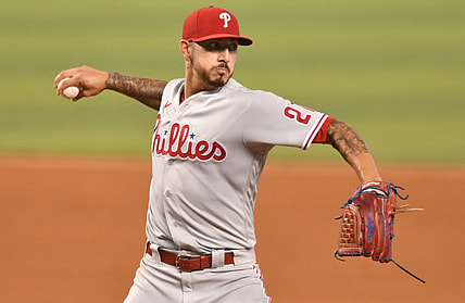 May 25, 2021; Miami, Florida, USA; Philadelphia Phillies starting pitcher Vince Velasquez (21) throws to first base during the first inning against the Miami Marlins at loanDepot Park. Mandatory Credit: Jim Rassol-USA TODAY Sports