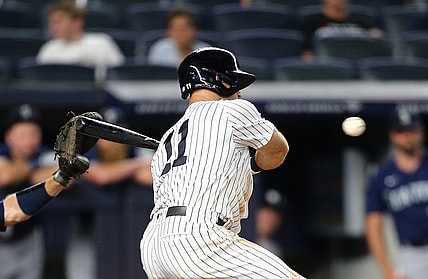 Aug 6, 2021; Bronx, New York, USA; New York Yankees center fielder Brett Gardner (11) hits a game winning walk off RBI single against the Seattle Mariners during the eleventh inning at Yankee Stadium. Mandatory Credit: Andy Marlin-USA TODAY Sports