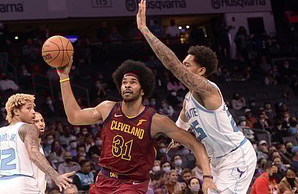 Nov 1, 2021; Charlotte, North Carolina, USA;  Cleveland Cavaliers center Jarrett Allen (31) moves past Charlotte Hornets forward PJ Washington (25) during the first half at the Spectrum Center. Mandatory Credit: Sam Sharpe-USA TODAY Sports
