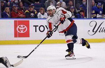 Dec 11, 2021; Buffalo, New York, USA;  Washington Capitals left wing Alex Ovechkin (8) takes a shot on goal during the third period against the Buffalo Sabres at KeyBank Center. Mandatory Credit: Timothy T. Ludwig-USA TODAY Sports