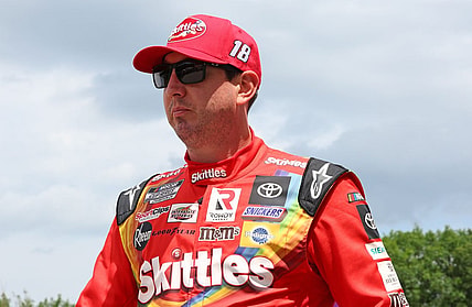 Jul 3, 2022; Elkhart Lake, Wisconsin, USA; NASCAR Cup Series driver Kyle Busch (18) before the start of the KWIK TRIP 250 at Road America. Mandatory Credit: Mike Dinovo-USA TODAY Sports
