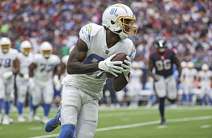 Oct 2, 2022; Houston, Texas, USA; Los Angeles Chargers wide receiver Mike Williams (81) runs with the ball after a reception during the second quarter against the Houston Texans at NRG Stadium. Mandatory Credit: Troy Taormina-USA TODAY Sports