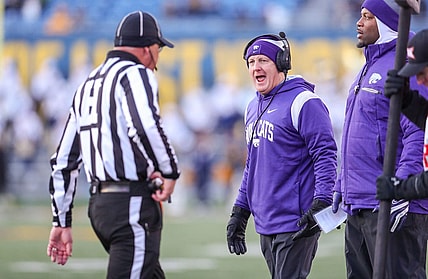 Nov 19, 2022; Morgantown, West Virginia, USA; Kansas State Wildcats head coach Chris Klieman talks to an official along the sidelines during the third quarter against the West Virginia Mountaineers at Mountaineer Field at Milan Puskar Stadium. Mandatory Credit: Ben Queen-USA TODAY Sports