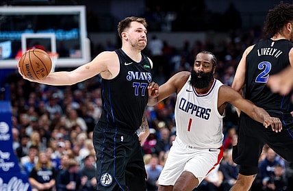 Nov 10, 2023; Dallas, Texas, USA;  Dallas Mavericks guard Luka Doncic (77) passes around LA Clippers guard James Harden (1) during the second quarter at American Airlines Center. Mandatory Credit: Kevin Jairaj-USA TODAY Sports