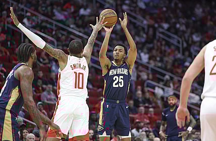 Jan 31, 2024; Houston, Texas, USA; New Orleans Pelicans guard Trey Murphy III (25) shoots the ball as Houston Rockets forward Jabari Smith Jr. (10) defends during the second quarter at Toyota Center. Mandatory Credit: Troy Taormina-USA TODAY Sports