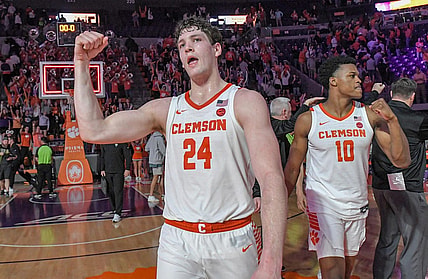 Feb 27, 2024; Clemson, South Carolina, USA; Clemson junior forward PJ Hall (24) and RJ Godfrey (10) celebrate after the Tigers beat Pitt 69-62 at Littlejohn Coliseum. Mandatory Credit: Ken Ruinard-USA TODAY Sports