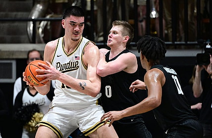 Mar 2, 2024; West Lafayette, Indiana, USA; Purdue Boilermakers center Zach Edey (15) pushes against Michigan State Spartans forward Jaxon Kohler (0) during the first half at Mackey Arena. Mandatory Credit: Marc Lebryk-USA TODAY Sports