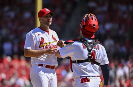 Sep 8, 2022; St. Louis, Missouri, USA;  St. Louis Cardinals starting pitcher Adam Wainwright (50) talks with catcher Yadier Molina (4) during the fifth inning against the Washington Nationals at Busch Stadium. Mandatory Credit: Jeff Curry-USA TODAY Sports