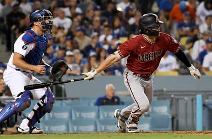 Sep 21, 2022; Los Angeles, California, USA; Arizona Diamondbacks left fielder Corbin Carroll (7) hits a RBI double during the 4th inning against the Los Angeles Dodgers at Dodger Stadium. Mandatory Credit: Richard Mackson-USA TODAY Sports
