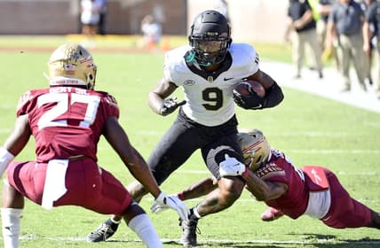 Oct 1, 2022; Tallahassee, Florida, USA; Wake Forest Demon Deacons wide receiver AT Perry (9) is tackled by Florida State Seminoles defensive back Renardo Green (8) during the first half at Doak S. Campbell Stadium. Mandatory Credit: Melina Myers-USA TODAY Sports
