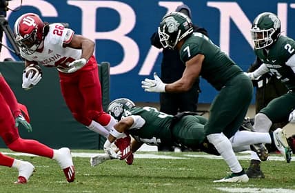 Nov 19, 2022; East Lansing, Michigan, USA;  Michigan State Spartans safety Khalil Majeed (34) tackles Indiana Hoosiers running back Josh Henderson (26) in the second quarter at Spartan Stadium. Mandatory Credit: Dale Young-USA TODAY Sports