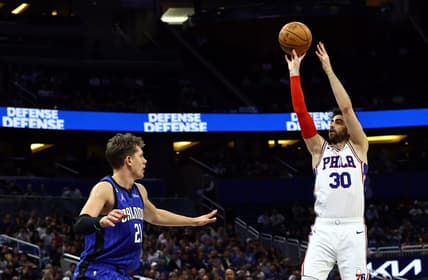 Nov 27, 2022; Orlando, Florida, USA; Philadelphia 76ers guard Furkan Korkmaz (30) shoots over Orlando Magic center Moritz Wagner (21) during the first quarter at Amway Center. Mandatory Credit: Kim Klement-USA TODAY Sports