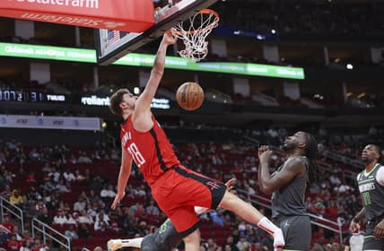 Jan 8, 2023; Houston, Texas, USA; Houston Rockets center Alperen Sengun (28) dunks the ball as Minnesota Timberwolves forward Taurean Prince (12) defends during the second quarter at Toyota Center. Mandatory Credit: Troy Taormina-USA TODAY Sports
