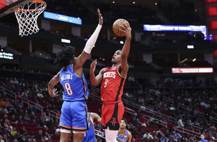 Feb 1, 2023; Houston, Texas, USA; Houston Rockets guard Josh Christopher (9) attempts to score a basket as Oklahoma City Thunder forward Jalen Williams (8) defends during the second quarter at Toyota Center. Mandatory Credit: Troy Taormina-USA TODAY Sports