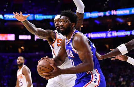 Nov 7, 2022; Philadelphia, Pennsylvania, USA; Philadelphia 76ers center Joel Embiid (21) shields the ball from Phoenix Suns forward Torrey Craig (0) in the first quarter at Wells Fargo Center. Mandatory Credit: Kyle Ross-USA TODAY Sports