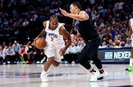 Dec 20, 2023; Dallas, Texas, USA;  LA Clippers forward Kawhi Leonard (2) controls the ball as Dallas Mavericks forward Grant Williams (3) defends during the second half at American Airlines Center. Mandatory Credit: Kevin Jairaj-USA TODAY Sports