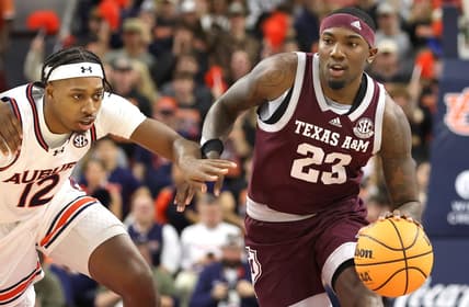 Jan 9, 2024; Auburn, Alabama, USA; Auburn Tigers guard Denver Jones (12) chases Texas A&M Aggies guard Tyrece Radford (23) during the first half at Neville Arena. Mandatory Credit: John Reed-USA TODAY Sports