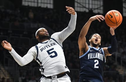 Jan 27, 2024; Indianapolis, Indiana, USA; Butler Bulldogs guard Posh Alexander (5) and Villanova Wildcats guard Mark Armstrong (2) battle for a rebound during the first half at Hinkle Fieldhouse. Mandatory Credit: Robert Goddin-USA TODAY Sports
