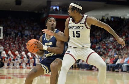 Jan 30, 2024; Dayton, Ohio, USA;  George Washington forward Darren Buchanan Jr. (3) drives against Dayton Flyers forward DaRon Holmes II (15) at University of Dayton Arena. Mandatory Credit: Matt Lunsford-USA TODAY Sports