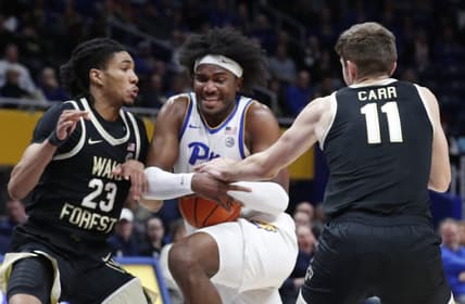 Jan 31, 2024; Pittsburgh, Pennsylvania, USA; Pittsburgh Panthers forward Blake Hinson (middle) goes to the basket against Wake Forest Demon Deacons guard Hunter Sallis (23) and forward Andrew Carr (11) during the first half at the Petersen Events Center. Mandatory Credit: Charles LeClaire-USA TODAY Sports
