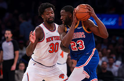 Dec 14, 2021; New York, New York, USA; Golden State Warriors forward Draymond Green (23) shield the ball from New York Knicks forward Julius Randle (30) during the second half at Madison Square Garden. Mandatory Credit: Vincent Carchietta-USA TODAY Sports