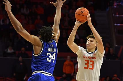 Nov 7, 2022; Champaign, Illinois, USA;  Illinois Fighting Illini forward Coleman Hawkins (33) shoots the ball over Eastern Illinois Panthers forward Jermaine Hamlin (34) during the first half at State Farm Center. Mandatory Credit: Ron Johnson-USA TODAY Sports