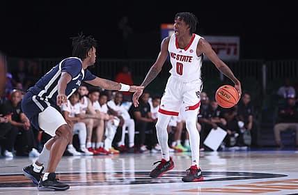 Nov 25, 2022; Paradise Island, BAHAMAS; North Carolina State Wolfpack guard Terquavion Smith (0) dribbles as Butler Bulldogs guard Jayden Taylor (13) defends during the first half at Imperial Arena. Mandatory Credit: Kevin Jairaj-USA TODAY Sports