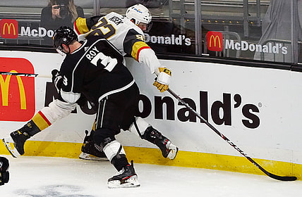 Mar 21, 2021; Los Angeles, California, USA; Vegas Golden Knights left wing Tomas Nosek (92) plays for the puck against Los Angeles Kings defenseman Matt Roy (3) during the third period at Staples Center. Mandatory Credit: Gary A. Vasquez-USA TODAY Sports