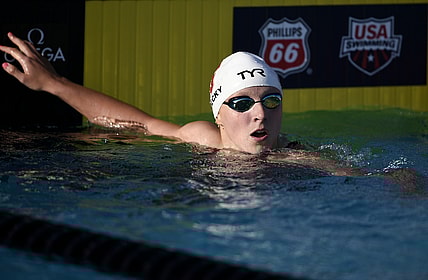 Jul 26, 2018; Irvine, CA, USA; Katie Ledecky (right) looks on after winning the Women's 200 LC Meter Freestyle final during the 2018 USA Swimming Phillips 66 National Championships swim meet at William Woollett, Jr. Aquatics Center. Mandatory Credit: Kelvin Kuo-USA TODAY Sports